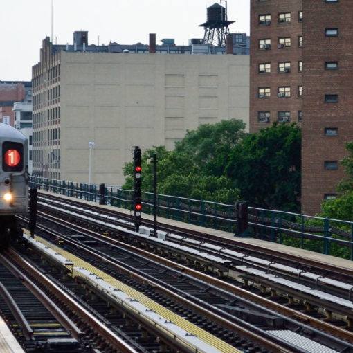 subway next to apartment buildings