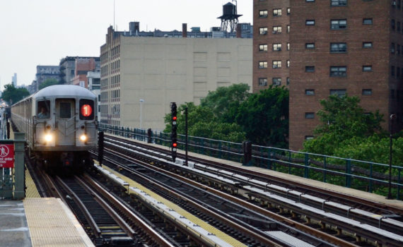 subway next to apartment buildings